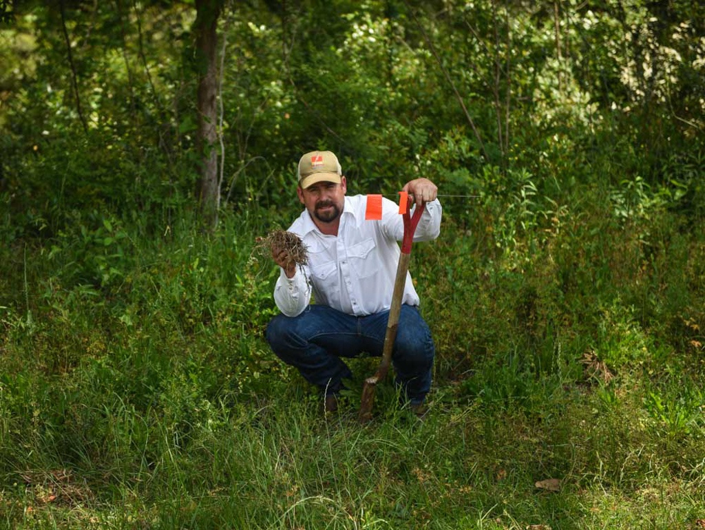 Spencer Smith holds a handful of soil at his yearly Build Soil Build Wealth Workshop 