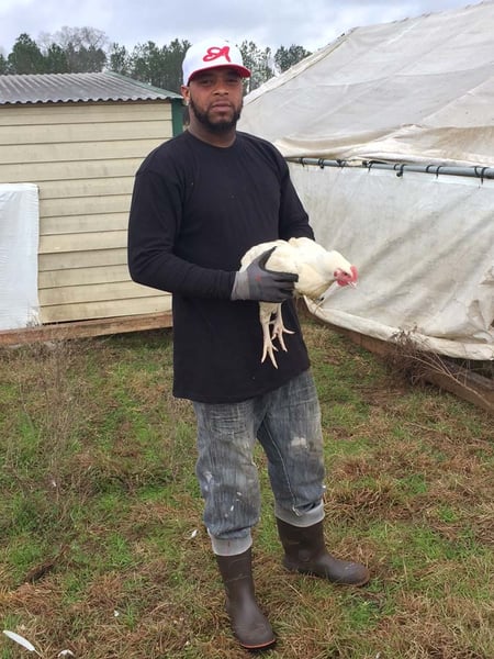 Jamaal Huff works in White Oak Pastures Poultry Production Department caring for our pasture-raised chickens