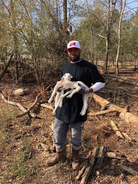 Jamaal Huff trains in the pasture raised hog, sheep, goat, and cattle departments.