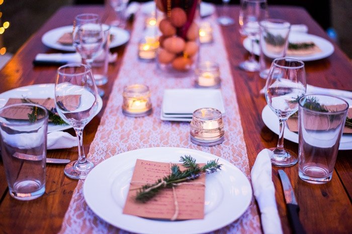 Dinner in the pasture under the stars by candlelight with lace and burlap runner local wine and pasture raised farm protein