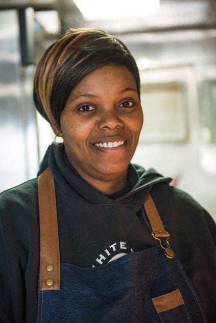 Shona serves breakfast lunch and dinner from the food truck and dining pavillion.jpg