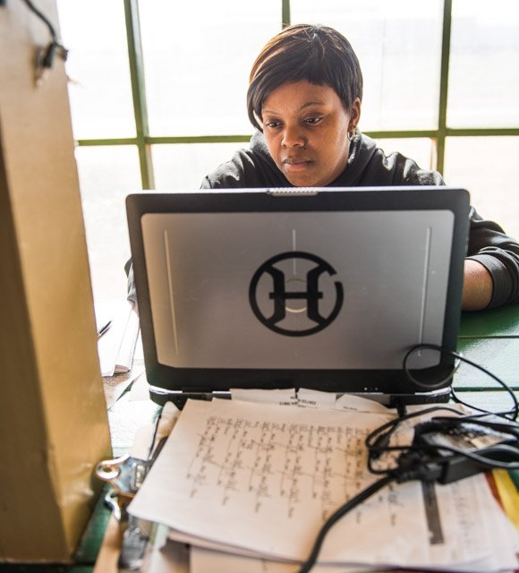 Lashona Butler keeping track of the records for our farm to table dining pavilion and food truck.jpg