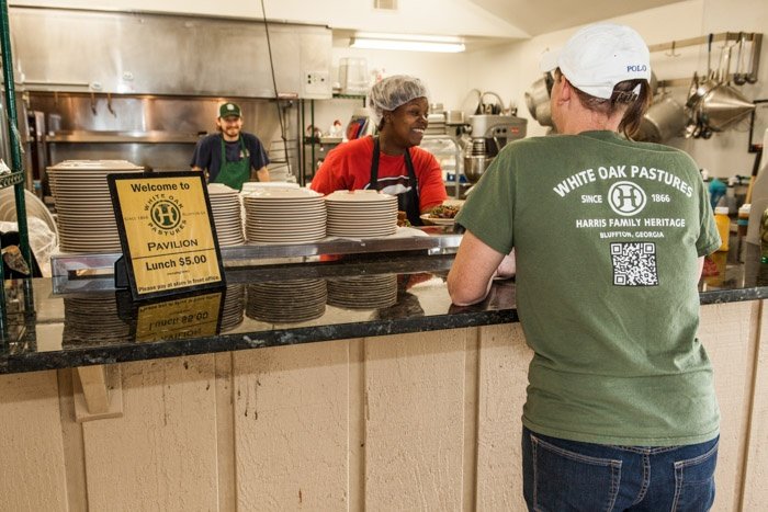 shona working the lunch line to serve our 140 employees a hot pasture raised meal.jpg