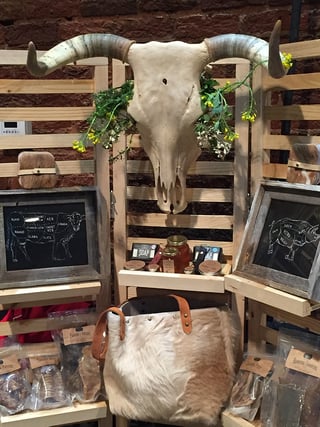 white oak pastures display table at 2018 flavor of georgia with handmade leather bag and pet treats.jpg