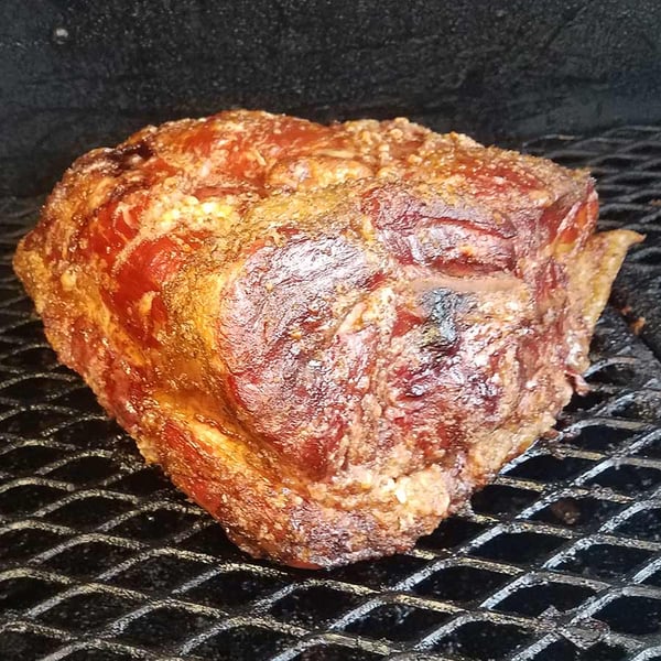 White Oak Pastures Picnic Pork Shoulder Roast in a Texas-style offset smoker.